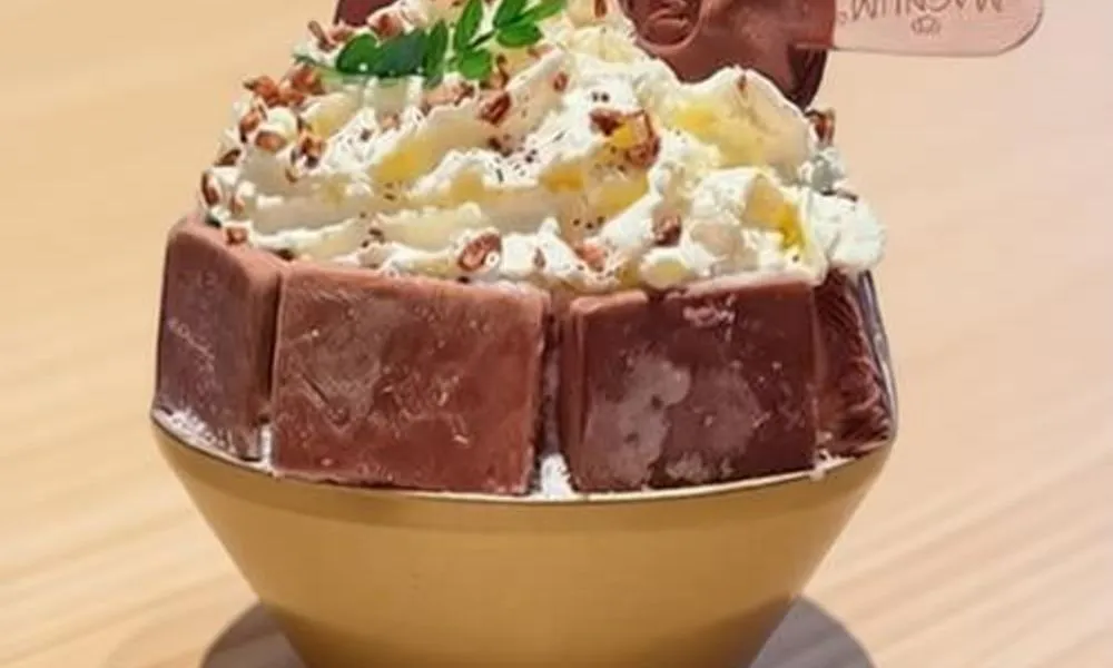 Magnum Chocolate ice cream sundae with whipped cream and nuts at Hi Daniel, a Dessert Shop restaurant in Tukwila